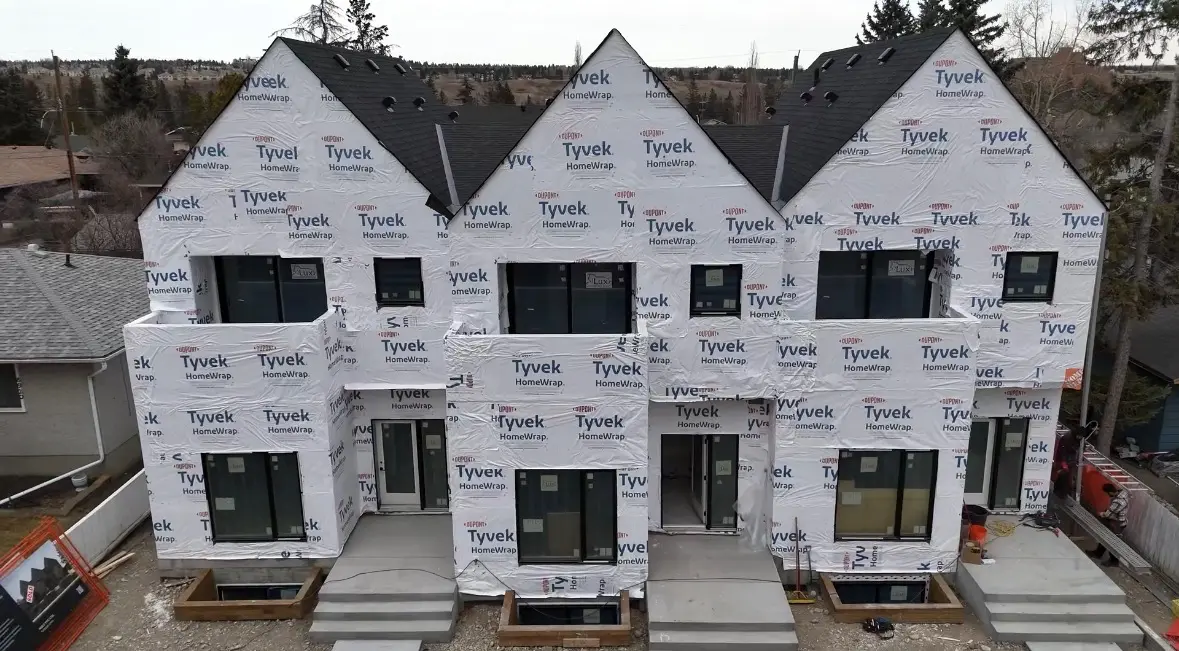 building envelope tyvek townhomes by All About Exteriors