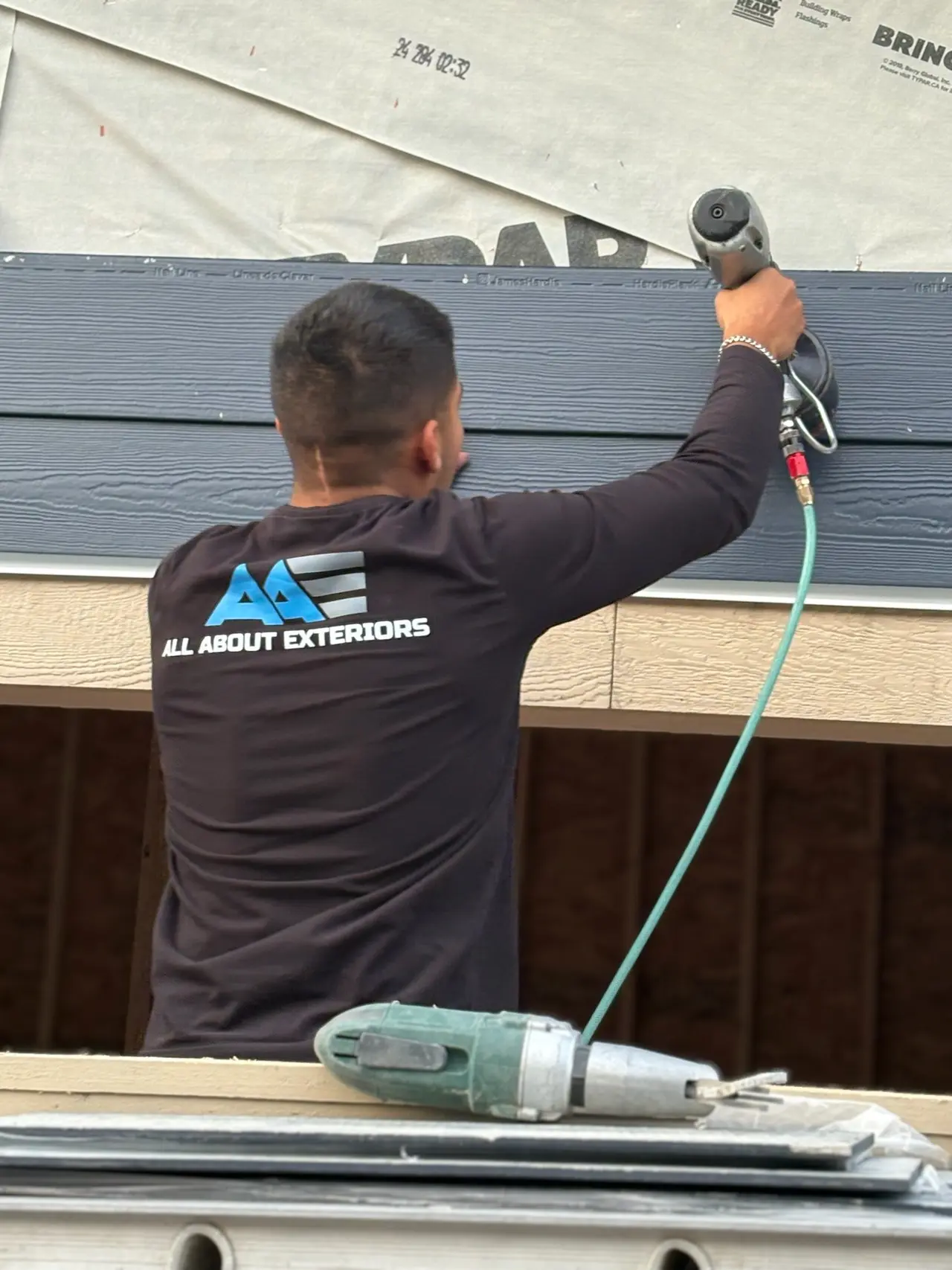 siding install crew by All About Exteriors