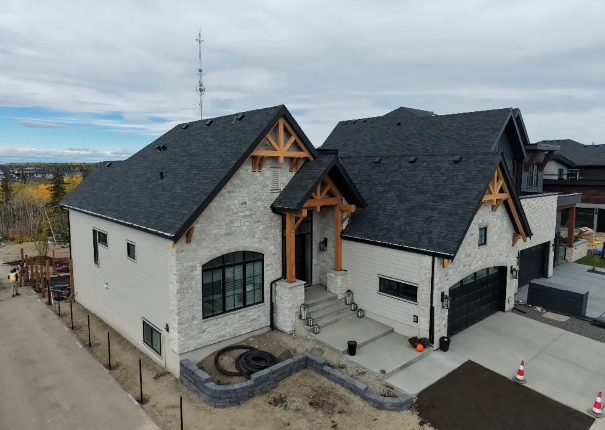 siding stone home by All About Exteriors