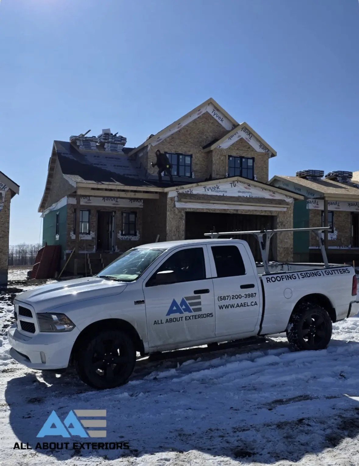 truck at winter new build by All About Exteriors