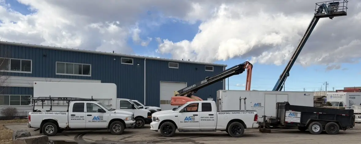 trucks at commercial job by All About Exteriors