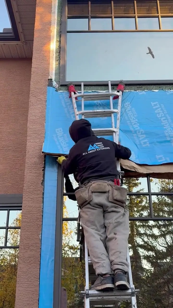 Video of the crew installing Henry Blueskin air and vapor barrier around windows