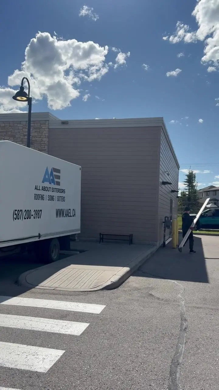Video of an All About Exteriors truck and crew on a commercial plaza job