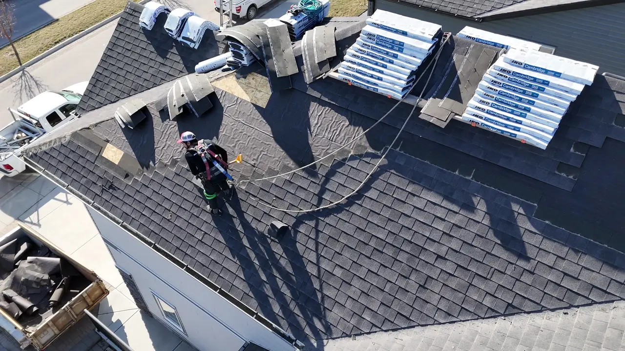 Drone video of the All About Exteriors crew working across a large shingle roof