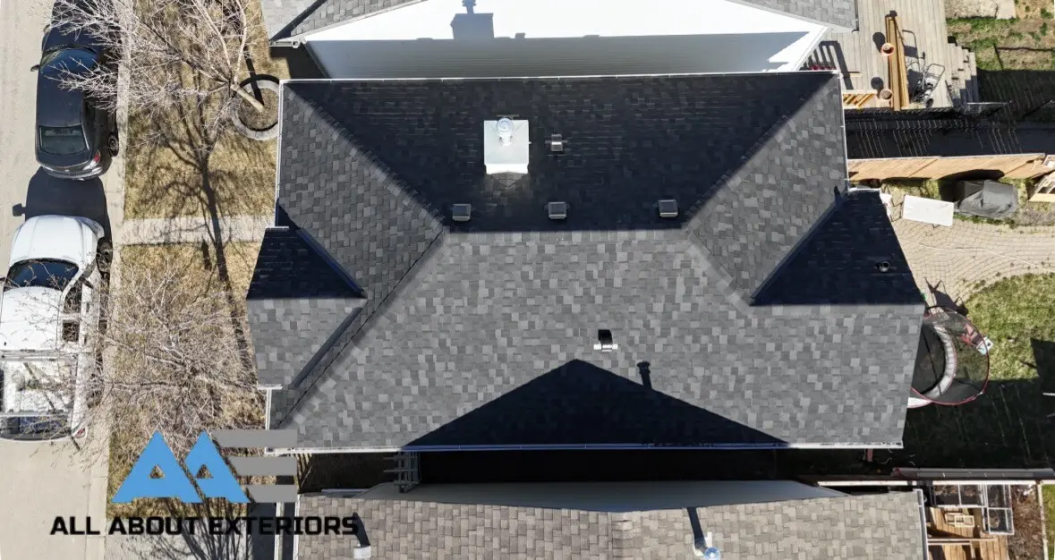 Drone photo of a finished dark hip roof